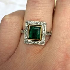 This ring is yellow gold on platinum and features an emerald cut 1.84ct natural emerald stone. The emerald is bezel-set in 18k yellow gold and surrounded by a halo of old European cut diamonds. The under-gallery is decorated with open-work. ✦GEMSTONE SPECIFICATIONS: Gemstones: Emerald, Diamond Emerald Weight: 1.84 Carats ✦ ENGAGEMENT RING SPECIFICATIONS: Ring Material: Platinum and 18k Yellow Gold ✦ WHAT COMES IN YOUR SHIPMENT: - Your Engagement Ring - Quality Ring Box - Jewelry Cleaner - UGL Ce Emerald Cut Emerald Ring, Estate Diamond Jewelry, Emerald Cut Diamond Engagement, Vintage Art Deco Rings, Emerald Wedding Rings, Bezel Engagement Ring, Bezel Set Ring, Engagement Ring Diamond Cut, Emerald Engagement