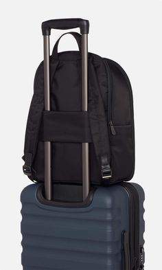 Our classic Chelsea Daypack has been reimagined with extra space. This smart, streamlined backpack has plenty of handy features: a back sleeve that slots over a suitcase handle, a full zip opener for easy packing and access, a zipped front pocket with card sleeve and key clip inside, a 16.5” laptop pocket, and an elasticated side pocket for a water bottle. The zipped, padded laptop pocket has an additional slip pocket for a tablet. Inside the backpack, there’s a removable packing pocket for shoe Business Backpack With Anti-theft Pocket, Backpack Luggage With Sleeve For Business Trips, Business Nylon Luggage With Zipper Closure, Business Nylon Backpack Luggage, Functional Backpack With Luggage Sleeve For Business Trips, Black Backpack With Anti-theft Pocket For Business Trips, Black Nylon Backpack For Business Trips, Nylon Business Backpack, Versatile Business Standard Backpack Luggage