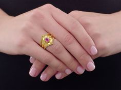 Etruscan styled opulence in high karat yellow gold with fine beaded detail along the outside of the band and in diamond formations surrounding a center oval-cut cherry red Burma ruby. Jewellery Marketing, Ruby Ring, Cherry Red, 22k Gold, Ruby, Cherry, Ring Size, Gems, Yellow Gold