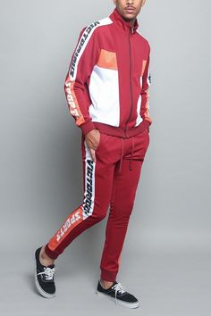 Sticking with the trends and dressing in style has never been so easy. Throw on our new super comfortable and stylish tri colored sport track suit. Featuring bold colors and writing down the arms and legs, with adjustable draw strings at the waist, and a functional zipper on the jacket. 60% Cotton, 34% Polyester, 6% Spandex Machine wash cold inside-out on gentle cycle with like colors, line dry Sporty Joggers With Drawstring For Streetwear, Sporty Streetwear Joggers With Drawstring, Casual Red Tracksuit For Jogging, Red Sporty Sweatpants For Leisure, Casual Red Tracksuit For Streetwear, Fall Sportswear Tracksuit For Sports, Red Cotton Sporty Tracksuit, Fall Sports Tracksuit, Sporty Fall Joggers With Elastic Side Panels