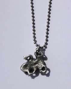 This is our hand cast, lead-free, fine pewter Toad Pendant Necklace on a 24 inch stainless steel military ball chain. The pewter pendant measures approximately 1 inch in diameter. It is hand cast/made in Michigan! It will be attached to our card in a clear package & would make a great gift! If you would like more quantity than what we have listed, please ask. We usually have more in stock OR we can let you know how long before we would have the quantity you need. You can add more pewter item Anglican Prayer Beads, Pewter Pendant, Military Ball, Hand Cast, Odessa, Toad, Ball Chain, Jump Rings, Necklace Pendant