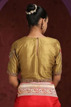 Golden blouse in raw silk base with a keyhole at the, embellished close neck, sleeves featuring parrot motif with hand embroidered zardozi work.
Component: 1
Pattern: Hand Embroidered
Type Of Work: Parrot Motifs
Neckline: Round
Sleeve Type: Short
Fabric: Raw Silk
Color: Gold
Other Details: 
Parrot motif on sleeves
Closure: Black shank button
Note: Saree worn by the model is not for sale
Occasion: Wedding - Aza Fashions Round Bird, Golden Blouse, Zardozi Work, Gold Blouse, Shank Button, Blouse For Women, Blouse Online, Embroidered Blouse, Raw Silk