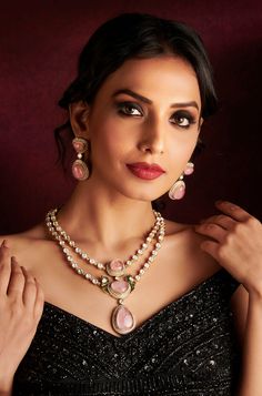 Adorn yourself with sophistication in this Polki double-layered necklace, embellished with exquisite pink-colored stones. Complete with matching earrings, this set is perfect for adding a touch of elegance to your reception ensemble. Finish: Rhodium Material: Brass, Polkis & Pink Stones Color: Pink Size: Free Size, Adjustable Closure Type: Draw String Box Contains: 1 Necklace, 1 Pair of Earrings Elegant Pink Bridal Necklace For Festive Occasions, Elegant Pink Bridal Necklace For Festive Seasons, Elegant Pink Hand Set Jewelry Sets, Elegant Pink Necklace For Festive Occasions, Elegant Pink Necklace For Reception, Pink Jewelry For Formal Festive Occasions, Pink Formal Jewelry For Festive Occasions, Festive Pink Necklace For Party, Elegant Pink Kundan Necklace Gift