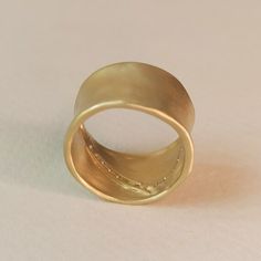 Handmade Thick Band Jewelry As Gift, Unique Hammered Rings In Recycled Gold, Handmade Gold Jewelry With Wide Band, Artisan Untreated Open Ring Jewelry, Ceremonial Hand Forged Ring Jewelry, Artisan Untreated Jewelry For Wedding, Artisan Untreated Wedding Jewelry, Hammered Brass Wide Band Jewelry, Handmade Thick Band Wedding Jewelry