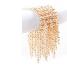 If you wish to achieve a stunning party look with something a little different, our Okore Multistrand Cluster Bracelet will not disappoint! Incorporating stunning Brown Wood beads of light and dark shades, and Pearl this cluster vine bracelet oozes style and panache. Is elastic threads is versatile to fit different hand sizes. It has been skillfully put together, with careful detail to attention, by our dedicated and capable artisans. Pair this stunning article with our breathtaking Bronze/Golde Pearl White Bracelets With Pearl Drop For Party, Pearl White Bracelet With Pearl Drop For Party, Elegant Pearl Bracelet For Party, Party Pearl White Beaded Bracelets With Pearl Chain, Party Pearl White Bracelets With Pearl Charm, Party Pearl White Beaded Bracelets, Pearl Bracelets With Pearl Charm For Parties, Elegant Pearl Drop Bracelet For Party, Party Pearl Bracelets With Pearl Chain