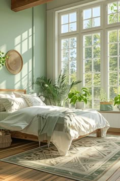 a bedroom with green walls and wooden flooring, plants in the window sill