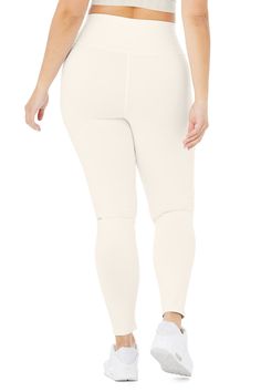 An on-trend high waistline on our classic Airbrush legging. Spotted on basically every it-girl, the High-Waist Airbrush Legging has an on-trend rise and all the best assets of the classic version, like no side seams and a yogi-tested fit that lifts and sculpts. Sculpts, smooths & lifts! No side seams & flat-locked seams for extra comfort Designed & uniquely fit to flatter every size Wear-tested by our in-house team for the perfect fit Alo Yoga® | High-Waist Airbrush Legging in Ivory, Micro-elastic Breathable White Bottoms, White Breathable Micro-elastic Bottoms, White Breathable Elastic Bottoms, White Activewear With Go-dry Micro-elastic Fit, Cream Sporty Activewear For Sports, White Alo Yoga Activewear For The Gym, Cream Stretch Activewear For Sports, White Activewear With Comfort Waistband For Workout, White Sporty Alo Yoga Activewear