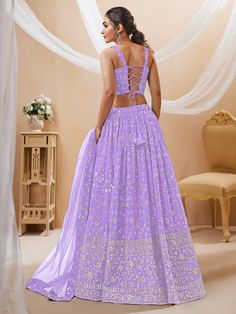 Fill vibrant hues in the upcoming wedding season with our fascinating Lehenga choli collection. This enchanting lavender sequins georgette lehenga choli with dupatta is the perfect pick for your weddings, receptions, and other occasions. Crafted with the utmost attention to detail, this stunning ensemble will surely make you stand out from the crowd.
The first and most evident benefit is its captivating color. Lavender exudes elegance and sophistication, making it an ideal choice for any special Lavender Anarkali Choli For Wedding, Lavender Choli With Dupatta For Reception, Anarkali Lavender Choli For Wedding, Anarkali Style Lavender Choli For Wedding, Lavender Anarkali Lehenga With Sheer Dupatta, Traditional Lavender Lehenga With Mirror Work, Lavender Lehenga With Dupatta For Reception, Reception Lavender Lehenga With Dupatta, Lavender Semi-stitched Sharara For Festive Occasions