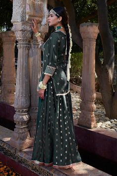 Teal chanderi short kurta embroidered with dori work. Comes with sharara and mustard yellow dupatta.
Components: 3
Pattern: Embroidery
Type Of Work: Dori, Pearls, Zari work
Neckline: Notched
Sleeve Type: Three quarter
Fabric: Kurta: Chanderi, Sharara: Banarasi Chanderi, Dupatta: Organza
Color: Green,Yellow
Other Details: 
Approx Length (in inches):
Kurta: 32
Sharara: 42
Note: The neckpiece worn by the model is not for sale
Occasion: Mehendi and Haldi - Aza Fashions Yellow Dupatta, Dori Work, Kurta Sharara Set, Chanderi Dupatta, Kurta Sharara, Short Kurta, Sharara Set, Zari Work, Pattern Embroidery