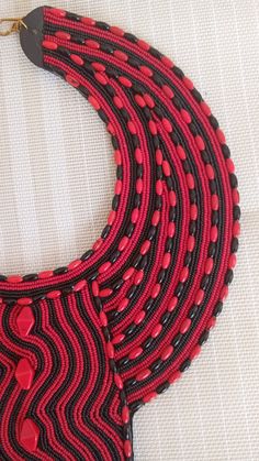 SALE African Choker necklace, Leather choker necklace, Zulu necklace, Beaded necklace, Adjustable necklace, Women jewelry, An authentic elegant necklace that can match with any outfit. 100% handmade Closure: hooks Color: Black and Red. Available in different colors. 3-5 days delivery via DHL Express The shipping fee is for the first item only and additional necklaces or items ship for free.Buy multiple items and pay shipping for 1 item only.The rest ships free.) Wholesale available at a fair pri Handmade Red Beaded Choker Necklace, Bohemian Red Necklace With Black Beads, Traditional Red Necklaces With Black Beads, Traditional Red Necklace With Black Beads, Red Beaded Necklaces As A Gift, Handmade Red Bib Necklace With Round Beads, Red Large Beads Choker Necklace, Red Beaded Choker Necklace As Gift, Red Beaded Choker Necklace For Gift