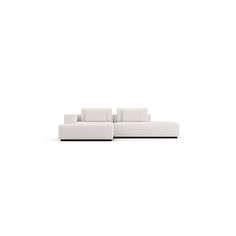 a white couch sitting on top of a white floor