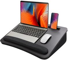 an open laptop computer sitting on top of a mouse pad