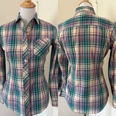 "Cute 80s style madras plaid button up shirt from Mervyn's Hot Line. Made of a lightweight cotton blend. Spread collar  Patch pocket on breast. Long tail. Barrel cuffs. Yoked back. Fitted cut with darts in front and back. Probably late 70s / early 80s.  In very good used condition.  Tagged Mervyns Hot Line Size 9  55/45 cotton poly  Measurements taken flat buttoned Pit to pit 18\" Waist: 16\" Hips: 17\" Sleeve: 30\"  Length shoulder seam to hem: 26\" Mervyns of California  Preppy style Madras pl Plaid Fitted Classic Shirt, Classic Plaid Fitted Shirt, Classic Fitted Plaid Shirt, Fitted Plaid Cotton Shirt, Fitted Long Sleeve Casual Flannel Shirt, Plaid Shirt With Buttons, Relaxed Fit, Plaid Shirt With Buttons In Relaxed Fit, Relaxed Fit Plaid Shirt With Buttons, Retro Cotton Flannel Shirt With Button Closure