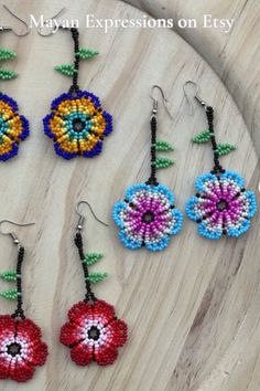 Thank you for your support. Check out Mayan Expressions on Etsy for more colors and designs. Adjustable Multicolor Earrings With Flower Charm, Adjustable Multicolor Flower Charm Earrings, Bohemian Beaded Earrings With Flower Charm, Multicolor Flower-shaped Earrings With Dangling Beads, Traditional Flower Drop Earrings With Dangling Beads, Bohemian Multicolor Flower Charm Earrings, Traditional Flower Shaped Beaded Earrings, Multicolor Flower Beaded Earrings With Dangling Beads, Multicolor Bohemian Earrings With Flower Charm