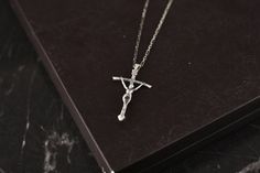 Elegant Silver Crucifix Necklace, Formal Silver Crucifix Cross Necklace, Silver Crucifix Necklace For Formal Occasions, Classic Silver Crucifix Necklace, Sterling Silver Crucifix Jewelry For Formal Occasion, Elegant Silver Chain Cross Necklace Gift, White Gold Crucifix Necklace With Silver Chain, White Gold Crucifix Necklace With Polished Finish, Sterling Silver Clavicle Chain Crucifix Jewelry