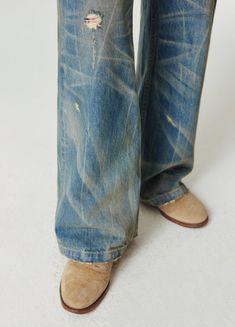 Discover the ultimate **Nevada Cowboy Inspired Spider Web Wash Denim**. These wide and baggy jeans, featuring a unique spider web wash and distressed detailing, are perfect for a bold, vintage look. Made from 100% denim cotton, these unisex jeans come with a slightly ripped hemline and an SP leather patch on the back. Available in various sizes, check out the detailed size chart below for the perfect fit. SIZE (CM) LENGTH WAIST BUTT EXTRA SMALL 101 69 90 SMALL 104 75 96 MEDIUM 106 79 100 LARGE 1 Distressed Wide Leg Relaxed Fit Flare Jeans, Distressed Wide Leg Flare Jeans With Relaxed Fit, Relaxed Fit Distressed Flare Jeans For Fall, Distressed Relaxed Fit Flare Jeans For Fall, Distressed Wide Leg Jeans In Relaxed Fit, Cotton Relaxed Fit Distressed Flare Jeans, Relaxed Fit Distressed Denim Blue Flare Jeans, Distressed Washed Blue Pants For Fall, Relaxed Fit Distressed Flare Jeans In Denim Blue