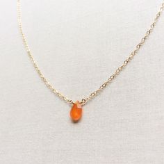 "This Carnelian necklace is made of genuine high quality faceted Carnelian. There are gold filled ,sterling silver and 14kt gold chain you can choose from. There are 2 sizes that you can choose from 16\" or 18\" in gold filled, sterling silver or 14k gold. This tiny carnelian necklace is light weight and elegant. The Carnelian jewelry stone is around 1.5 carats. This tiny carnelian necklace is great for layering with other gold necklaces. This orange stone necklace is delicate and perfect to go Gold Carnelian Jewelry With Faceted Beads, Gift Chalcedony Faceted Necklaces, Gift Carnelian Crystal Necklace In Orange, Orange Faceted Jewelry Gift, Orange Carnelian Crystal Necklace As Gift, Orange Carnelian Crystal Necklace For Gift, Orange Carnelian Crystal Necklace Gift, Amber Necklaces With Faceted Beads For Gift, Amber Faceted Beads Necklace For Gift