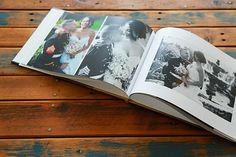 an open photo book on a wooden table with photos taken from the wedding party's album