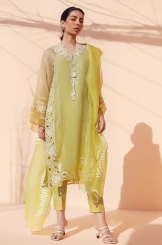 This lemon yellow ombre organza kurta exhudes elegance with floral embroidery and cutwork detailing. The look is completed with matching trousers and an organza dupatta with scallop detailing. Elegant Yellow Salwar Kameez With Intricate Embroidery, Elegant Yellow Kurta With Sheer Dupatta, Yellow Organza Kurta For Festive Occasions, Elegant Yellow Lawn Suit For Wedding, Elegant Summer Salwar Kameez With Sheer Dupatta, Festive Yellow Organza Kurta, Festive Yellow Elegant Lawn Suit, Elegant Tissue Silk Dupatta For Summer, Elegant Summer Tissue Silk Dupatta