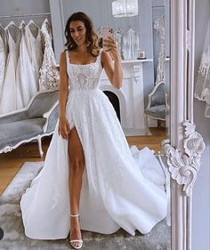 a woman taking a selfie in her wedding dress