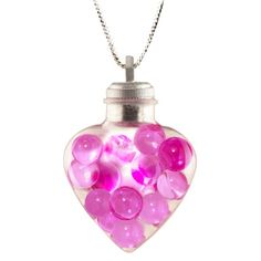 a pink heart shaped glass bottle filled with lots of purple candies on a chain