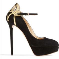 Details & Care Make Any Evening More Elegant With A Stunning Charlotte Olympia Pump. Twists Of Gilt-Gleam Leather Highlight The Soaring Suede Design With An Exquisite Spun-Sugar Effect. 5 1/4" Heel; 1 1/4" Platform (Size 38.5). Adjustable Strap With Buckle Closure. Suede And Metallic Leather Upper/Leather Lining And Sole. In Mint Condition No Box Size 6 Designer Suede Platform Heels, Luxury Black Platform Heels, Elegant Black Heels With Gold-tone Hardware, Charlotte Olympia Heels, Sugar Effect, Luxury Black Heels With Gold-tone Hardware, Charlotte Olympia Shoes, Spun Sugar, Charlotte Olympia