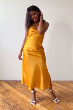 Looking for the perfect classy dress that will have you shining bright at your next event? This gold slip dress outfit offers a touch of glamour for any occasion. Whether you're pairing this look with sneakers for a causal classy look or wearing as a wedding guest look, this champagne slip dress is a stunning choice to show your feminine and classy side. Click the link to shop this product and make a statement at your next special event. Champagne Slip Dress, Classy Summer Dress, Gold Slip Dress, Cowl Neck Slip Dress, Slip Dress Outfit, Slip Midi Dress, Spring Outfits Dresses, Elegant Midi Dresses, Wedding Guest Looks