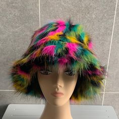 Cool YK2 style MORE SUITABLE FOR BIGGER HEADS Long pile can shed this is normal to its makeup Rihanna Style on Trend faux fur bucket hat REAL PICTURES  16cm combined length Fuzzy bucket hat heavy hat 100% polyester  58cm head circumference Long pile can shed Please note defects can not be ruled out The colours you will see on the monitor may slightly differ with the colours you will see in real life Please note texture ,fabric fluffiness can not determined by picture as  pictures will always see fluffier than in real life. Buy with confidence as I have high standards of what I sell All questions welcome Please allow a margin of error on all measurements. Thank you Winter Retro Brimmed Bucket Hat, Retro Brimmed Bucket Hat For Winter, Retro Brimmed Winter Bucket Hat, Funky Winter Festival Hats, Fun Winter Festival Hats, Fitted Multicolor Winter Hats, Multicolor Winter Bucket Hat, Trendy Multicolor Winter Hats, Trendy Fitted Multicolor Hats