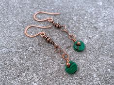 These dainty malachite drop pendant earrings feature a single malachite gemstone pendant wrapped in high-quality pure copper.  Flaunt this modern, sophisticated look with a minimalist deco feel to compliment your style and elevate any outfit. ## Sizing Total length is 1.5 inches. ## Materials Every item is 100% handmade and one-of-a-kind. The wire-wrapped raw copper jewelry is oxidized and polished to beautifully highlight details of the wirework. Finally, it's sealed with a protective clear coa Copper Dangle Jewelry As Gift, Copper Dangle Jewelry For Gift, Nickel Free Bronze Minimalist Jewelry, Nickel-free Minimalist Bronze Jewelry, Minimalist Nickel-free Bronze Jewelry, Bronze Wire Wrapped Drop Earrings, Minimalist Dangle May Birthstone Jewelry, Handmade Minimalist Green Jewelry, Handmade Minimalist Jewelry For May Birthstone