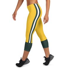 Support the Packers with these uniform capri leggings. These super soft and comfortable Green Bay football uniform leggings won't lose their stretch and provide that support and comfort you love. .: 82% polyester/18% spandex .: Material has a four-way stretch, which means fabric stretches and recovers on the cross and lengthwise grains .: Made with a smooth, comfortable microfiber yarn .: Precision-cut and sewn after printing .: Please note that contact with rough surfaces and velcro fasteners s Sporty Moisture-wicking Activewear For Game Day, Cheerleading Sportswear For Sports Season, Game Day Moisture-wicking Activewear For Sports Season, Moisture-wicking Team-colored Activewear For Sports, Sporty Stretch Leggings For Sports Events, Moisture-wicking Activewear For Cheerleading, Sporty Activewear For Game Day, Moisture-wicking Activewear For Game Day, Sporty Leggings For Sports Events