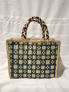 Up for sale is a Vintage Woven Basket Weave Handbag Market Handmade Medium Green Tan Brown. The dimensions are approximately: 11.5 Inches in length 4.5 Inches in width 8 Inches in height Overall in good to very good vintage condition as shown in photos. Thanks for checking out my ad! Be sure to check out the other items available for sale in my store. All of my items are sent out with tracked shipping. If you would prefer a cheaper shipping rate without tracking feel free to contact me for a quo Woven Rectangular Satchel For Travel, Rectangular Woven Satchel For Travel, Natural Color Rectangular Box Bag For Daily Use, Rectangular Straw Bag For Shopping, Handwoven Rectangular Bag For Daily Use, Rectangular Natural Satchel With Top Handle, Green Rectangular Satchel For Shopping, Natural Rectangular Shoulder Bag For Market, Natural Rectangular Satchel With Top Handle