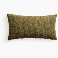 a green pillow on a white background