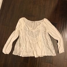 3/4th Sleeve Top Sooo Cute Has See Through Panel With Lace And So Elegant. Never Worn In Perfect Condition Casual White Blouse With 3/4 Sleeves, White Casual Blouse With 3/4 Sleeves, Bohemian Off White Long Sleeve Top, Casual White Peasant Top With 3/4 Sleeve, White Casual Peasant Top With 3/4 Sleeves, White 3/4 Sleeve Blouse For Vacation, White Long Sleeve Peasant Top For Fall, Casual White 3/4 Sleeve Peasant Top, Casual Long Sleeve Peasant Top For Brunch