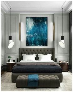 a large bed sitting in the middle of a bedroom next to a painting on the wall