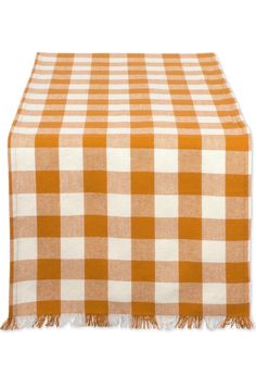 an orange and white checkered table cloth