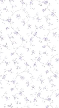 a white and purple wallpaper with small flowers on the bottom half of it,