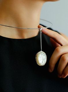 Product Details Material: silver-plated/925 silver/black agate/white mother-of-pearl/wood-grain marble Size: The inner diameter of the collar is 13cm, and the inner circumference is about 41cm Weight: about 16.5g Color Options: White: Adorned with delicate white mother-of-pearl, it is a timeless choice that exudes tenderness. Black: Classic black agate offers versatile elegance suitable for any occasion. Brown: The earthy charm of wood grain stone presents a refined option that's both distinct a Sliver Earrings, Slider Necklace, Mother Of Pearl Pendant, Sterling Silver Choker, Minimalist White, Baroque Pearl Earrings, Gemstone Pendants, Pendant Choker, Silver Choker