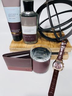 For the special man in your life, show him how much you appreciate him with this handsome men's gift basket. In your basket/box you will receive: 1 - Stuhrling Men's Monaco Brown Leather Watch (44mm) 1 - Leather & Brandy Shower Gel by Bath & Body Works (10 oz) 1 - Leather & Brandy Ultra Hydration Body Creme with Shea Butter by Bath & Body Works (8oz) 1 - Timberland Two-Tone Cognac Genuine Leather Wallet (5" L x 4" W x 1.5" H) with 8 Card Slots and ID Window 1 - Sabary Leather Wrapped Whiskey Glass (11.5 oz) 1 - Black Reusable Gift Box with Magnetic Closure (9.5"x9.5"x4") If you are ordering multiple items, shipping costs may vary. We are a family-owned business and operated from Lawrenceville, GA. Gift giving has served as a way for us to show love to one another, as well as others. The ac Gift Basket Valentines Day, Mens Gift Basket, Basket Valentines Day, Fathers Day Gift Basket, Basket Gifts, Body Creme, Gift Baskets For Men, Brown Leather Watch, Men Gifts