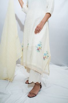 Off white embroidered kurta with multicoloured floral motifs. Paired with schiffli pant and dupatta.
Component: 3
Pattern: Embroidered
Type Of Work: Thread work
Neckline: Boat neck
Sleeve Type: Three quarter
Fabric: Cotton, Voile
Color: White
Other Details: 
Cutwork hem pant
Crinkle cotton dupatta
Occasion: Work - Aza Fashions Boat Neck Kurta, Crinkle Cotton, Kurta Set For Women, Cotton Dupatta, How To Hem Pants, Thread Work, Kurta Set, Cotton Voile, Floral Motifs