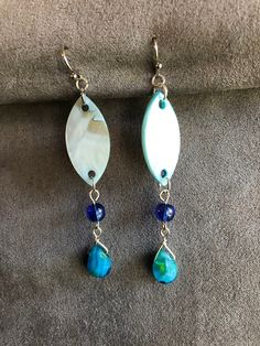 Light and swinging these blue dangles have a sheen of mother of pearl. With glass bead accents complimenting the pointed oval, these will have people turning to look. The colors of the ocean flow into your hair and show off your style. Wear them at the beach, the pier, pool or to your dinner date. Fun gift for a friend, teacher or yourself. Blue Bohemian Pearl Drop Earrings, Blue Pearl Drop Bohemian Earrings, Blue Dangling Beads Teardrop Earrings, Adjustable Blue Teardrop Dangle Earrings, Blue Bohemian Drop Earrings, Bohemian Blue Drop Earrings, Blue Dangle Earrings, Dinner Date, Etsy Earrings Dangle