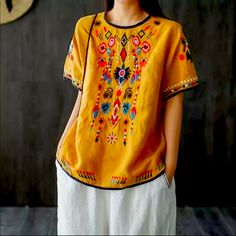 Embroidered Floral Shirt Size S Shoulder 18.9” Bust 43.3” Length 25.6” Sleeve 8.27” 100% Cotton Linen Import Yellow Embroidered Short Sleeve Top For Spring, Bohemian Crew Neck Top With Geometric Embroidery, Casual Yellow Embroidered T-shirt, Bohemian Tops With Geometric Embroidery And Crew Neck, Embroidered Crew Neck Blouse, Embroidered Long Sleeve T-shirt For Summer, Yellow Casual Short Sleeve Embroidered Top, Yellow Short Sleeve Embroidered Casual Top, Casual Yellow Embroidered Short Sleeve Top