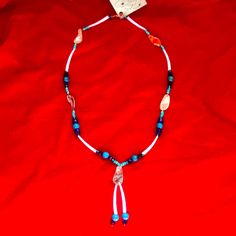 Beautiful Turquoise Beads, Dentalium White Shell Beads, Abalone, Cobalt Blue Faceted Beads, And Glass Beads Complete This Unique Native American Style 24”Necklace. Lariat Beaded Necklace With Gemstone Beads For Beach, White Necklace With Dangling Beads, Southwestern Style White Jewelry With Dangling Beads, Southwestern Necklaces With Dangling Beads And Adjustable Fit, Southwestern Necklace With Dangling Beads And Adjustable Fit, White Adjustable Necklace With Dangling Beads, Adjustable White Necklaces With Dangling Beads, Adjustable White Beaded Necklace With Dangling Beads, Adjustable Lariat Beaded Necklace With Polished Beads