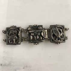 Details: Lovely 1940's Italian theme sterling bracelet. Images of Angels and birds (possibly phenix) grace this sweet bracelet. Would make a lovely gift! The bracelet is stamped Sterling on the inside of the clasp. Please ask all necessary questions prior to placing an order. Measurements: The bracelet measures 6 1/2 inches. The width of the bracelet is 3/4 inch. Condition: The overall all condition of this bracelet is very good. Collectible Sterling Silver Antique Bracelet, Vintage Silver Charm Bracelet For Formal Occasions, Antique Charm Bracelet For Formal Occasions, Vintage Silver Bracelet With Box Clasp, Vintage Silver Bracelets With Box Clasp, Vintage Adjustable Charm Bracelet With Engraving, Vintage Adjustable Engraved Charm Bracelet, Antique Sterling Silver Bracelets, Antique Silver Bracelets With Box Clasp