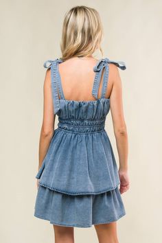 A washed denim mini dress featuring straight neckline, shoulder ties, elasticized waist and layered skirt Details: Self : 90% Cotton 10% PolyesterLining: 100% Polyester Size & Fit - Model is 5`7" And Wearing Size Small- Measurements Taken From Size Small- Approx. Length: 33" Casual Tiered Denim Dress, Washed Denim Blue Mini Dress, Blue Washed Mini Denim Dress, Blue Washed Denim Mini Dress, Blue Washed Mini Dress, Washed Blue Mini Denim Dress For Day Out, Cotton Mini Dress Medium Wash, Washed Cotton Mini Denim Dress, Washed Cotton Denim Mini Dress