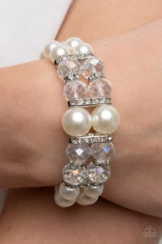 Timelessly Tea Party White Bracelet - Paparazzi Accessories  Held together by white rhinestone encrusted silver frames, a stretchy pair of bubbly pearl bracelets are infused with white rhinestone encrusted silver rings, iridescent crystal-like beads, and oversized white pearls for a timeless finish.  Sold as one individual bracelet. Pink Pearl Bracelet, White Pearl Bracelet, Iridescent Crystal, Bracelet Online, White Bracelets, Red Bracelets, White Rhinestone, Stretchy Bracelets, Colourful Necklace