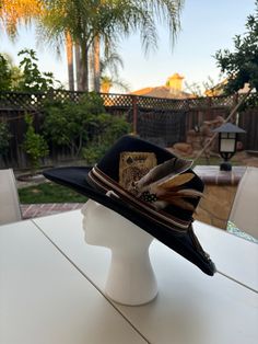 Our unique one of a kind hats are made with love and customized based on a vintage western aesthetic <3 Each piece is a one of one design  Why Choose Us? We take pride in crafting hats that not only look good but also feel great to wear. Each piece is carefully made with attention to detail, ensuring you receive a product that meets the highest standards of quality. When you purchase from us, you're not just buying a hat--you're investing in a statement piece that reflects your individuality and Western Black Hat Band For Western-themed Events, Western Black Felt Hat For Western-themed Events, Western Style Black Top Hat For Western-themed Events, Western Black Hat For Western-themed Events, Vintage Hats For Western-themed Events And Kentucky Derby, Western Style Black Hat For Western-themed Events, Vintage Handmade Hats For Western-themed Events, Western Style Hat For Rodeo, Vintage Handmade Hat For Western-themed Events