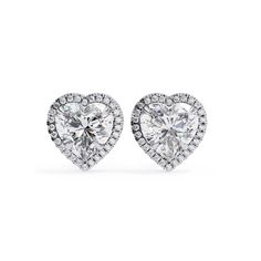 These captivating 5.20 CT heart-shaped lab-grown diamond stud earrings are a true embodiment of modern luxury and romantic design. Each earring features a stunning, IGI certified VS+ F+ clarity heart lab-grown diamond set in your choice of 14k black, white, yellow, or rose gold, providing a personal touch to this exquisite piece. The dainty and elegant heart shape adds a unique, sentimental value, making these earrings a perfect gift for someone special or a lovely treat for yourself. The exceptional quality and brilliance of these diamonds ensure they will sparkle magnificently in any light. Ideal for daily wear or special occasions, these earrings are sure to impress and cherish. PRODUCT DETAILS Metal Type: 14K Gold, White Gold / Yellow Gold / Rose Gold  Total Diamond Weight: 5.20 ctw To Luxury Brilliant Cut Heart Earrings For Valentine's Day, Classic Diamond Heart Earrings For Valentine's Day, Heart Cut Diamond Earrings With Prong Setting, Luxury Diamond Heart Earrings For Valentine's Day, Classic Heart-shaped Brilliant Cut Earrings, Luxury Heart-shaped Diamond Earrings With Prong Setting, Classic Brilliant Cut Heart Earrings, Classic Heart Cut Brilliant Earrings, Luxury Heart Earrings With Brilliant Cut For Anniversary