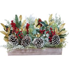 an arrangement of pine cones, holly and berries in a wooden box with greenery