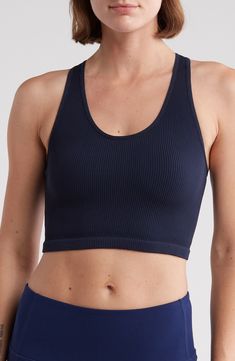 A ribbed texture distinguishes a longline bra with a seamless profile for easy layering whether lounging or heading to the gym. Scoop neck Sleeveless 91% nylon, 9% spandex Machine wash, tumble dry Imported Ribbed Medium Support Yoga Crop Top, Sporty Ribbed Seamless Tops, Ribbed Scoop Neck Sporty Activewear, Sports Ribbed Scoop Neck Sports Bra, Solid Ribbed Scoop Neck Activewear, Sporty Ribbed Scoop Neck Sports Bra, High Stretch Ribbed Solid Sports Bra, Sporty Ribbed Activewear With Scoop Neck, Sports Ribbed Scoop Neck Tank Top