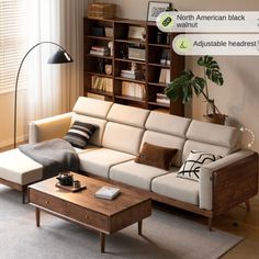 a living room with a couch, coffee table and bookshelf on the wall